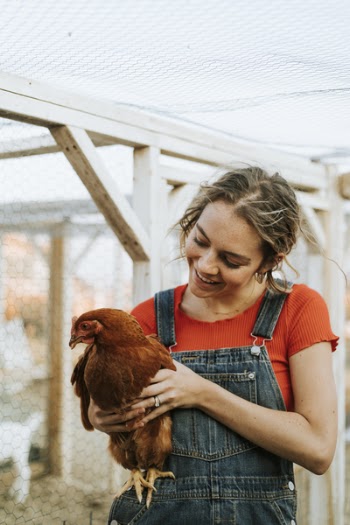 Woman Carrying Hen