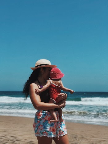 Woman Carrying Her Child