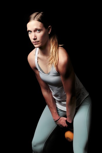 Woman Carrying Kettlebell