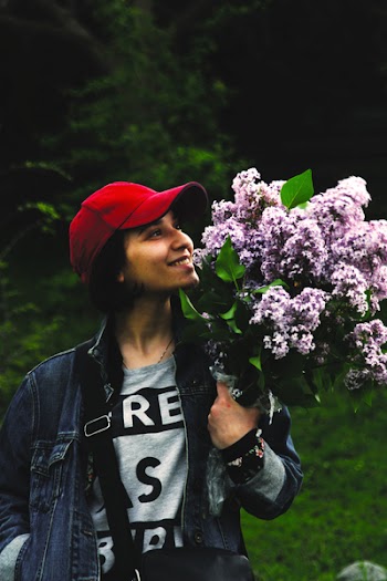 Woman Carrying Purpler Lilac Bouquet