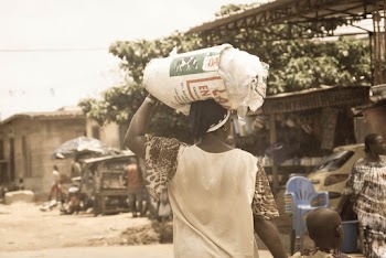 Woman Carrying Sack