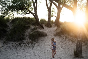 Woman Carrying Toddler Beside Trees