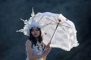 woman carrying white umbrella