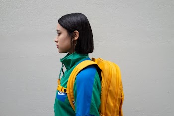 Woman Carrying Yellow Backpack