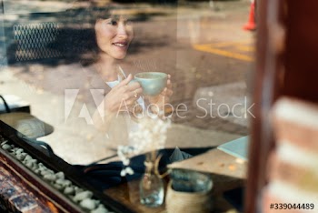 Woman chilling out with coffee at cafe