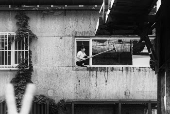 Woman Cleaning Window