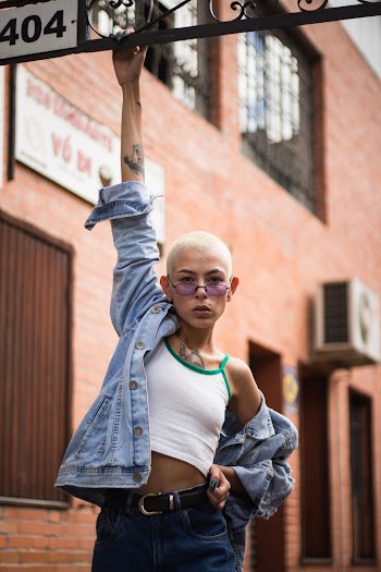 Woman Clinging on Metal Frame