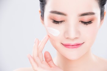 woman close eyes and touch face with beauty skin care concept