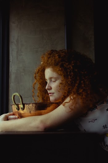 Woman Closed Her Eyes While Holding Brown Bowl