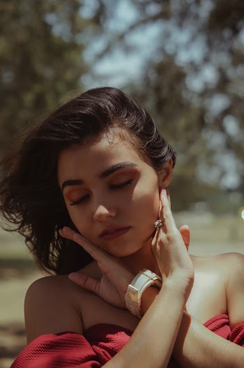 Woman Closing Eyes While Putting Both Hands On Her Face