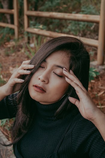 Woman Closing Her Eyes