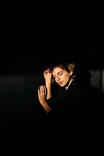 Woman Closing Her Eyes