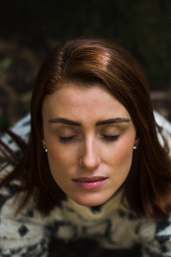 Woman Closing Her Eyes