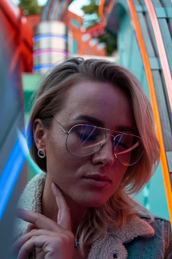 Woman Closing Her Eyes Wearing Eyeglasses
