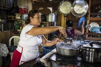 Woman cooking in local kitchen, | Free Photo - rawpixel