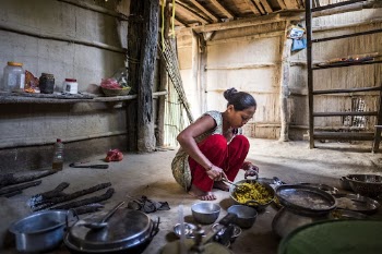 Woman cooking in local kitchen, | Free Photo - rawpixel