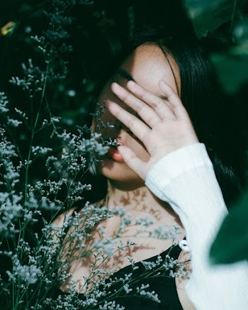 Woman Cover Her Face with Her Hand