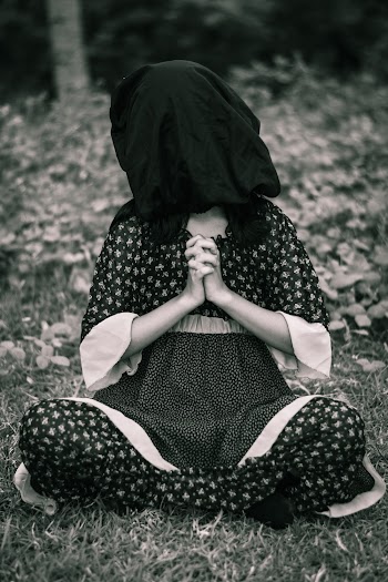 Woman Covered With Black Textile on Head