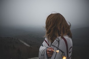 woman covered with white blanket