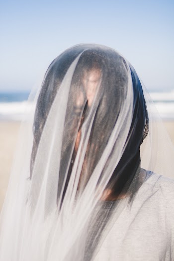 Woman Covered With White Veil