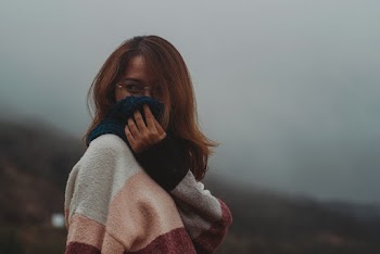 Woman Covering Face With Blue Scarf