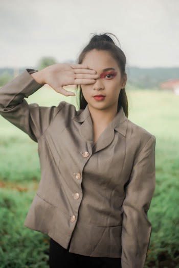 Woman Covering Her Eye With Her Hand