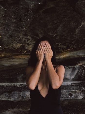 Woman Covering Her Eyes