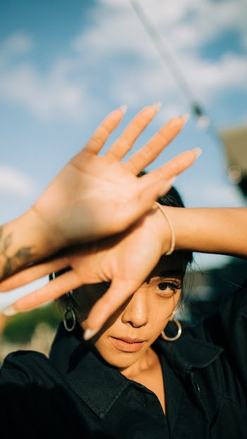 Woman Covering Her Face