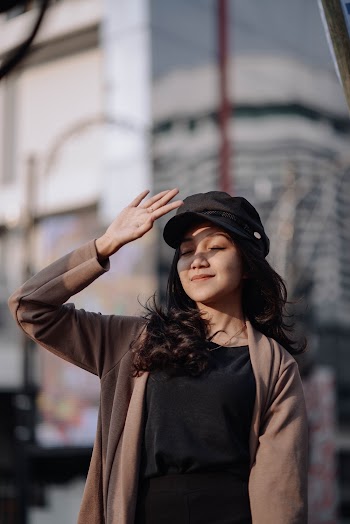 Woman Covering Her Face from Sun