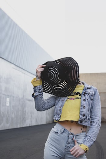 Woman Covering Her Face With Black Sun Hat