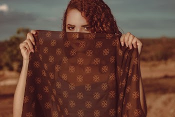 Woman Covering her Face with Brown Dupatta