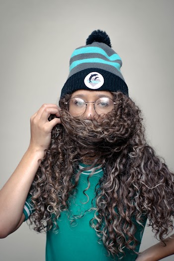 Woman Covering Her Face With Her Hair