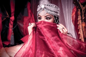 Woman Covering Her Face With Red Cloth