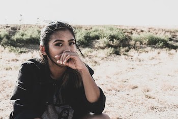 Woman Covering Her Mouth Using Her Left Hand