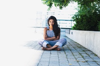Woman Crosses Arms And Legs With Angry Face