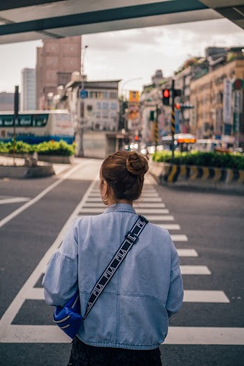 Woman Crossing A Pedestrian Lane