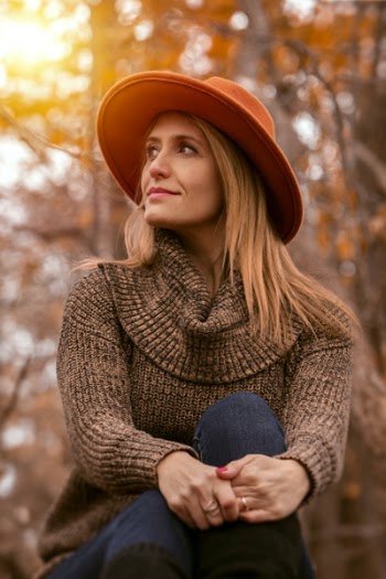 Woman Crossing Legs Near Tree during Golden Hour