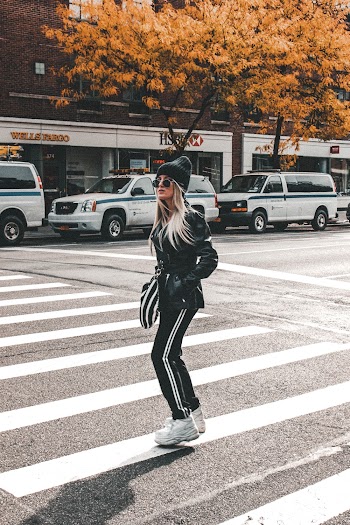 Woman Crossing on Pedestrian Lane