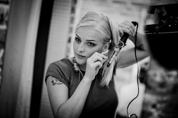 Woman Curling Hair