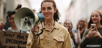 Woman demonstrator protesting with megaphone