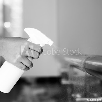 Woman disinfecting the railings during coronavirus outbreak