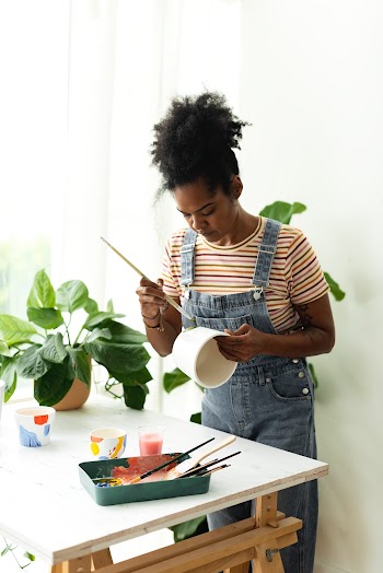Woman DIY pot painting hobby at home | Free stock photo | High Resolution image