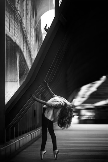 Woman Doing Ballet Dance on Side Walk in Grayscale Photo