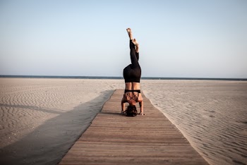 Woman Doing Exercise on Brown Surface