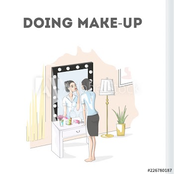 Woman doing make up at the mirror