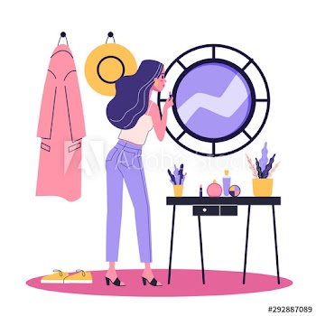 Woman doing makeup in front of the mirror