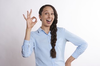 Woman Doing Money Hand Sign