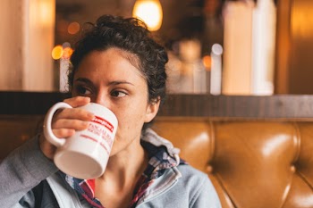 Woman Drinking Cup of Beverage