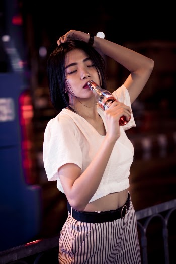 Woman Drinking from A Bottle