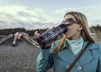 Woman Drinking from Bottle